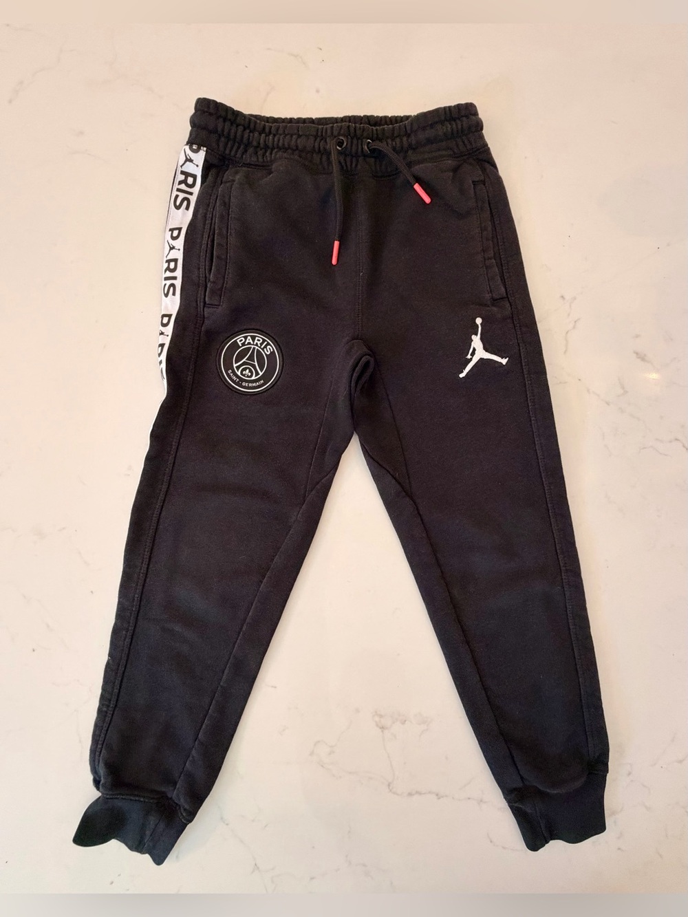 Official Jordan x Paris St. Germaine Kids Black Jogger Sweatpants. Size Small